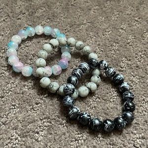 Blue and Pink bracelet, Black and White bracelet and a Marble bracelet.